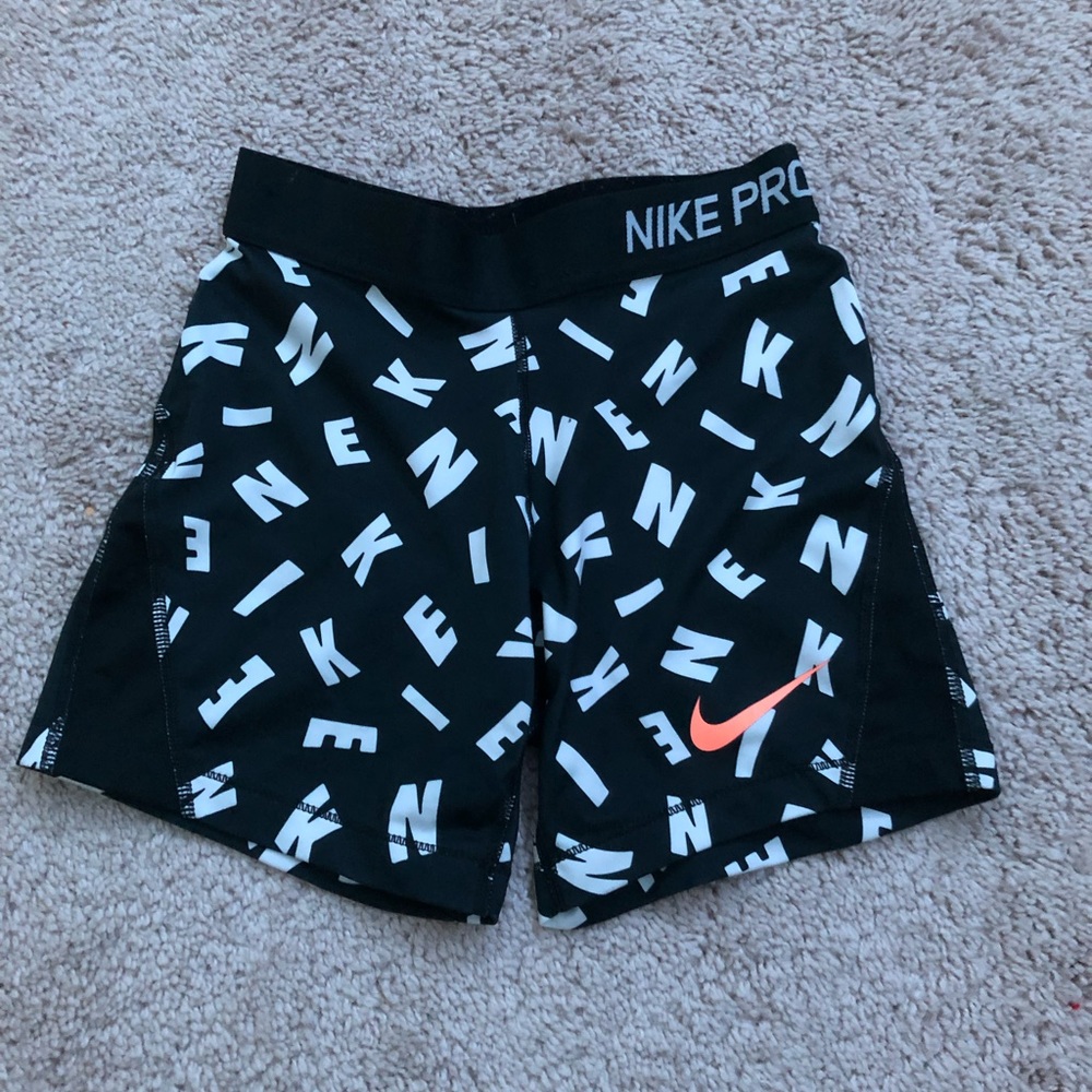 black and white letter nike pros
